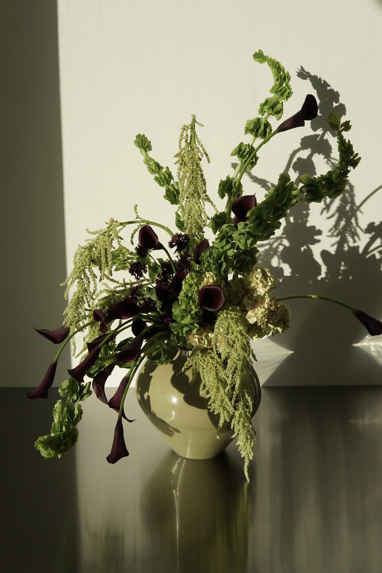 Large orange and green floral arrangement