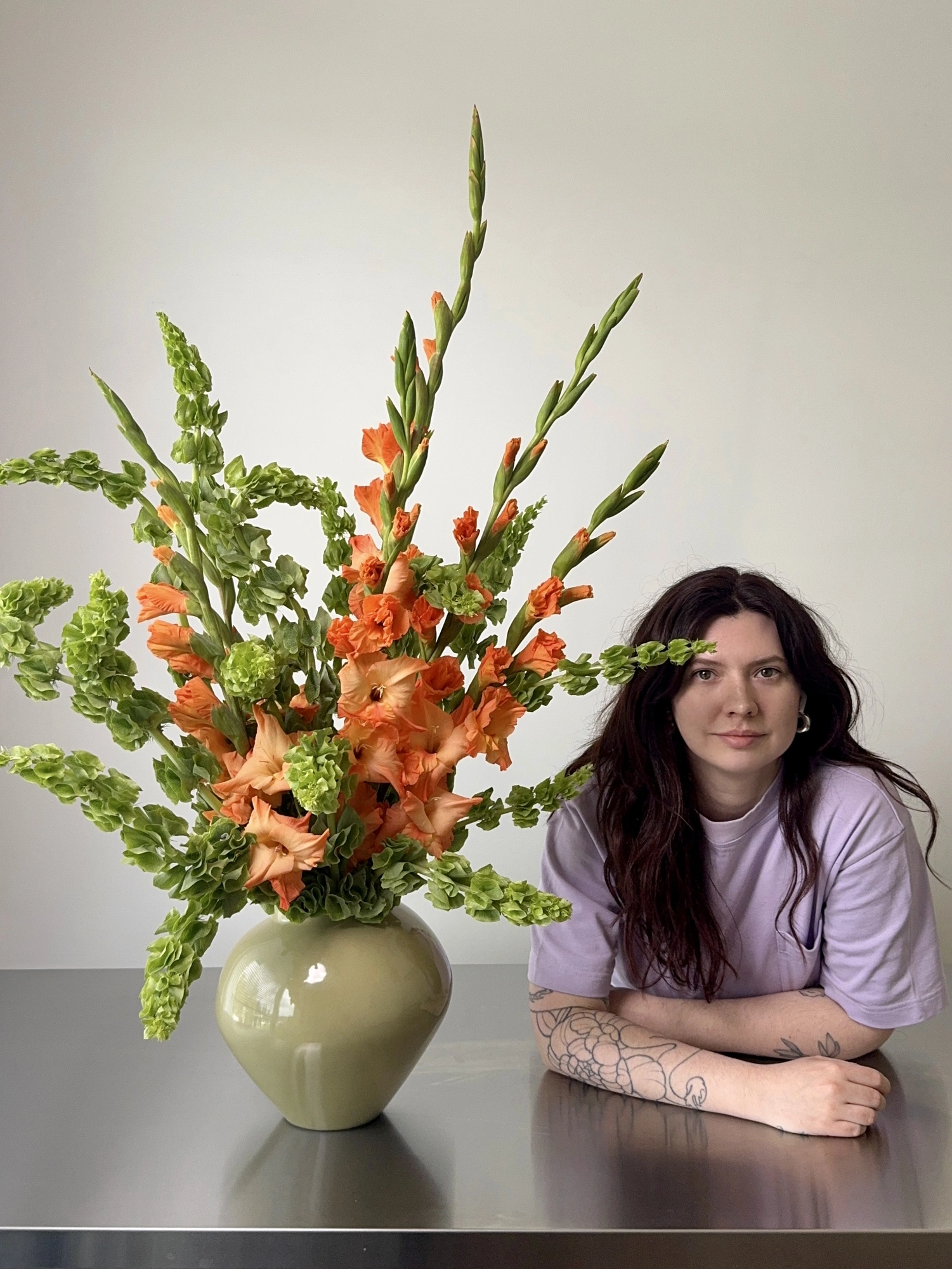 Tanya, founder of Flöde, arranging flowers in Vancouver